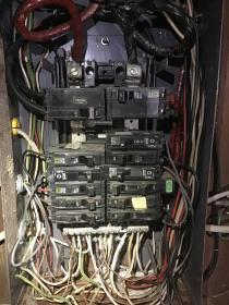 Before a completed residential electrical repair project in the Queensbury, NY area